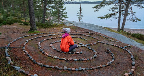 person sitting in a labyrinth